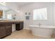 Bathroom features a large soaking tub and walk-in shower at 1989 Marsh Hen Vlg, Deland, FL 32720