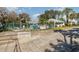 Community pool with seating and shaded areas at 1989 Marsh Hen Vlg, Deland, FL 32720