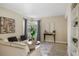 Living room with corner windows and built-in shelving at 2115 Valencia Rd, Orlando, FL 32803