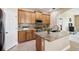 Kitchen boasts granite countertops and modern cabinetry at 23907 Sardinia Dr, Sorrento, FL 32776