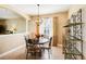 Bright dining room with a charming round table and decorative shelving at 23907 Sardinia Dr, Sorrento, FL 32776