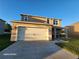 Two-story house with attached garage and landscaping at 2582 Glacier Express Ln, Tavares, FL 32778