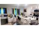 Open concept kitchen and living area with modern appliances at 2582 Glacier Express Ln, Tavares, FL 32778