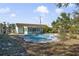 Large backyard with mature trees and a kidney-shaped pool at 2763 E Waco Dr, Deltona, FL 32738