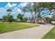 Brick home with circular driveway and mature trees at 2822 Tupelo Ct, Longwood, FL 32779