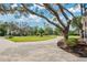 Long driveway leading to a home with mature trees at 2822 Tupelo Ct, Longwood, FL 32779