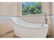 Modern bathroom with freestanding bathtub and updated fixtures at 2822 Tupelo Ct, Longwood, FL 32779