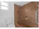 Small bathroom with a shower/tub combo and updated fixtures at 3541 Holliday Ave, Apopka, FL 32703