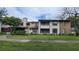 Two-story condo building with balcony and landscaping at 4641 Cason Cove Dr # 2124, Orlando, FL 32811