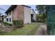 Condo building exterior with brick and siding, showcasing stairs and landscaping at 4641 Cason Cove Dr # 2124, Orlando, FL 32811