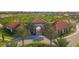 Resort-style community entrance with palm trees and Spanish-style architecture at 5160 Oakbourne Ave, Davenport, FL 33837
