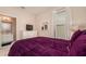 Guest bedroom with a queen bed, dresser, and en-suite bathroom at 5160 Oakbourne Ave, Davenport, FL 33837