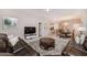 Open living space with comfortable seating and view into dining area at 5160 Oakbourne Ave, Davenport, FL 33837