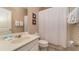 Bathroom with tub shower, single vanity, and white linens at 5160 Oakbourne Ave, Davenport, FL 33837