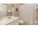 Bathroom with tub shower, single vanity, and white linens at 5160 Oakbourne Ave, Davenport, FL 33837