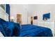 Main bedroom with king-size bed, dresser, and views into the dining room at 5160 Oakbourne Ave, Davenport, FL 33837