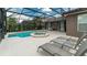 Screened pool and spa with patio furniture at 5160 Oakbourne Ave, Davenport, FL 33837