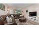 Relaxing living room featuring a sectional sofa and coffee table at 5160 Oakbourne Ave, Davenport, FL 33837