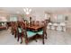 Elegant dining room featuring a large table and seating for eight at 5160 Oakbourne Ave, Davenport, FL 33837