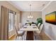 Elegant dining room with marble table and chandelier at 5367 Penway Dr, Orlando, FL 32814