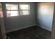 Spacious bedroom with gray walls and dark gray flooring at 5900 Judy Dee Dr, Orlando, FL 32808