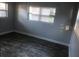 Simple bedroom with gray walls and dark gray flooring at 5900 Judy Dee Dr, Orlando, FL 32808
