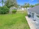 Backyard with patio, string lights, and a view of the neighborhood at 7471 Crooked Lake Cir, Orlando, FL 32818