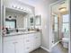 Bathroom with a vanity, granite countertop, and a shower at 7471 Crooked Lake Cir, Orlando, FL 32818