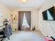 Bedroom with a home office setup and large window at 7471 Crooked Lake Cir, Orlando, FL 32818