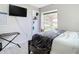 Bedroom with a large bed, window, and plenty of natural light at 7471 Crooked Lake Cir, Orlando, FL 32818