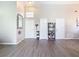 Bright entryway with light wood flooring and a decorative mirror at 7471 Crooked Lake Cir, Orlando, FL 32818
