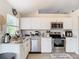 Clean kitchen, featuring stainless steel appliances and granite countertops at 7471 Crooked Lake Cir, Orlando, FL 32818