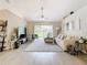 Spacious living room with a large sectional sofa and sliding glass doors at 7471 Crooked Lake Cir, Orlando, FL 32818