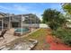 Spacious backyard with a large pool and patio at 12512 Tillingham Sw Ct, Orlando, FL 32837