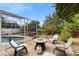 Peaceful backyard with fire pit and seating area at 12512 Tillingham Sw Ct, Orlando, FL 32837