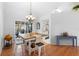 Bright dining area with wooden table and view of the pool at 12512 Tillingham Sw Ct, Orlando, FL 32837