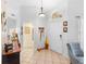 Inviting entryway with tiled flooring and coat rack at 12512 Tillingham Sw Ct, Orlando, FL 32837