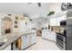 Eat-in kitchen with granite countertops and stainless steel appliances at 12512 Tillingham Sw Ct, Orlando, FL 32837