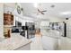 Modern kitchen featuring stainless steel appliances and granite countertops at 12512 Tillingham Sw Ct, Orlando, FL 32837