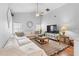 Relaxing living room with a sectional sofa and ample natural light at 12512 Tillingham Sw Ct, Orlando, FL 32837