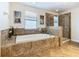 Bathroom with soaking tub and walk-in shower at 1522 Moon Valley Dr, Davenport, FL 33896