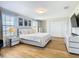 Main bedroom with king bed and modern furniture at 1522 Moon Valley Dr, Davenport, FL 33896