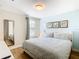King bedroom with light walls, large mirror and window at 1522 Moon Valley Dr, Davenport, FL 33896