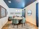 Bright dining room with a round table, four chairs, and a view of the kitchen at 1522 Moon Valley Dr, Davenport, FL 33896