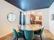 Open concept dining room with glass-top table and kitchen access at 1522 Moon Valley Dr, Davenport, FL 33896