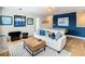 Fun game room with foosball, sofa and wood-look flooring at 1522 Moon Valley Dr, Davenport, FL 33896