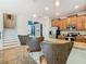 Kitchen with wood cabinets, granite countertops, and stainless steel appliances at 1522 Moon Valley Dr, Davenport, FL 33896