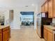 Open kitchen with view of dining area and staircase at 1522 Moon Valley Dr, Davenport, FL 33896