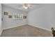 Spacious bedroom with neutral color palette and wall-to-wall carpet at 2045 Woody Dr, Windermere, FL 34786