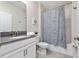 Bathroom with tub shower, vanity, and toilet at 2770 Bookmark Dr, Kissimmee, FL 34746